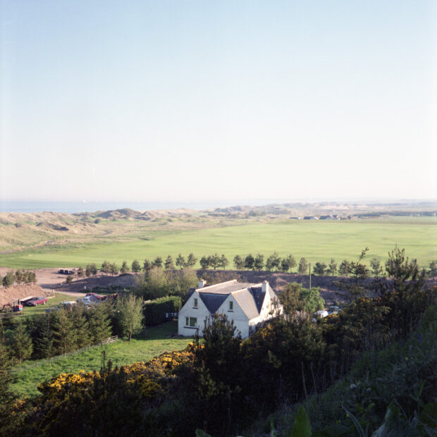 Susan MunroÕs home situated in themiddle of the Trump development.The ground in front of SusanÕs househas been raised and leveled and alarge pile of sand with trees planted in it now blocks theview in every directionÒThey used to sit up there in the