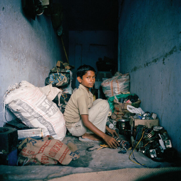 A young worker in a backyard recycling yard in Shastri Park on the outskirts of Delhi. The highest exposures from these harmful and toxic chemicals are inevitably to the most vulnerable urban poor. The burning of plastics and metals, using acid treatments and breaking cathode ray tubes are all hazardous and polluting activities which take place with little concern for human health and safety and no consideration for the environment. © Sophie Gerrard 2006, all rights reserved A young worker in a backyard recycling yard in Shastri Park on the outskirts of Delhi. The highest exposures from these harmful and toxic chemicals are inevitably to the most vulnerable urban poor. The burning of plastics and metals, using acid treatments and breaking cathode ray tubes are all hazardous and polluting activities which take place with little concern for human health and safety and no consideration for the environment. © Sophie Gerrard 2006, all rights reserved