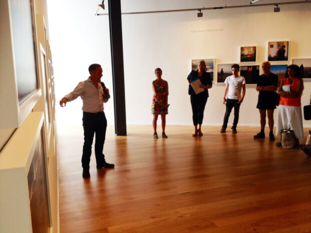 Jeremy Sutton-Hibbert talks to the audience at Impressions Gallery about his body of work 'Edge of an Empire', which is exhibited as part of 'Beyond The Border: New Contemporary Photography from Scotland' on show at Impressions Gallery Bradford 1st July - 27th September 2014. image © Colin McPherson July 2014
