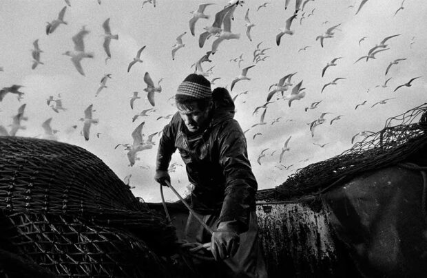 Bill Smith secures the nets, aboard the 'Argosy' seine-net fishing boat in the North Sea, Scotland, February 1995. Photograph by ©Jeremy Sutton-Hibbert 1995.