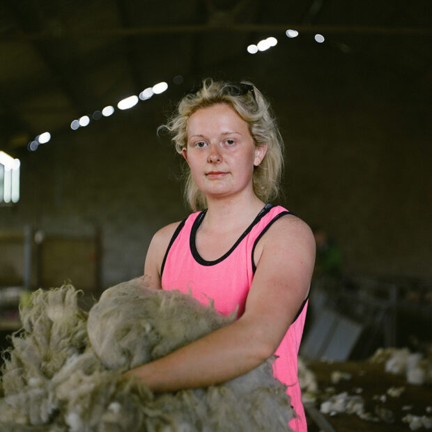 Anna MacKinnon rolling fleeces at Amulree, Perthshire. June 2019
